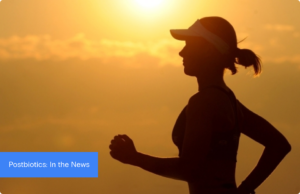 Woman in shadow jogging on a partly cloudy day