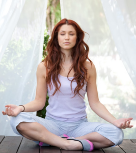 Woman in yoga pose demonstrating well-being.